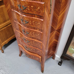 Stunning French seven drawer Kingwood and marquetry inlaid semainier with a beautiful marble top. In good original detailed condition.