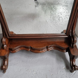 Antique Victorian 19th Century full length Mahogany cheval mirror. Mirror supported on two elegant scrolled upright support and stands on moulded base with four scrolled feet and castors.