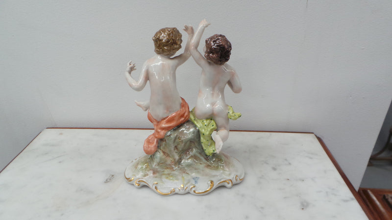 Lovely porcelain 19th century Figurines from the Naples factory. It is in good condition with only slight damage to one finger.