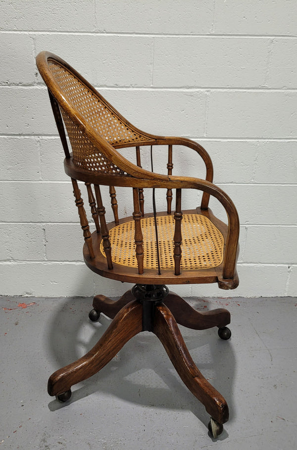 Elm Bentwood and cane swivel desk chair. In good original detailed condition and is comfortable to sit in.