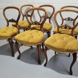 Set of six upholstered Victorian balloon back chairs. In good original detailed condition.