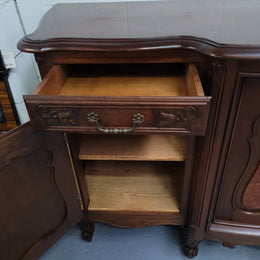 Fabulous Louis XV style French Walnut and Burr Walnut four door sideboard. Each door panel has beautiful Burr Walnut panels and open up to an adjustable shelf. Beautiful handles and two drawers for added storage. In good original detailed condition.