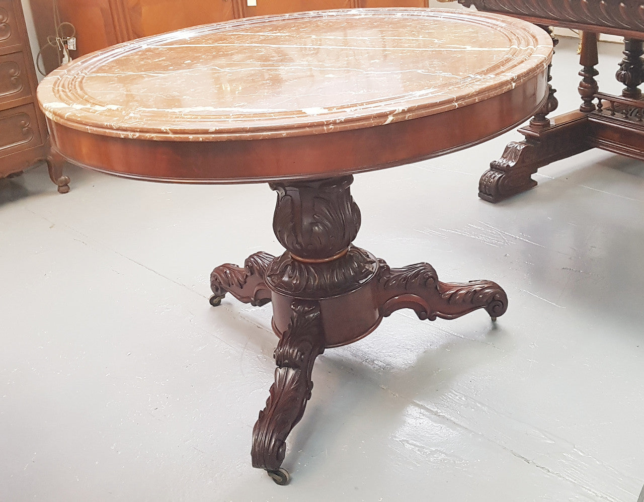A superb early 19th century French Louis Philippe mahogany centre table, with original round carved rough marble with reeded-edge and is in good original condition.