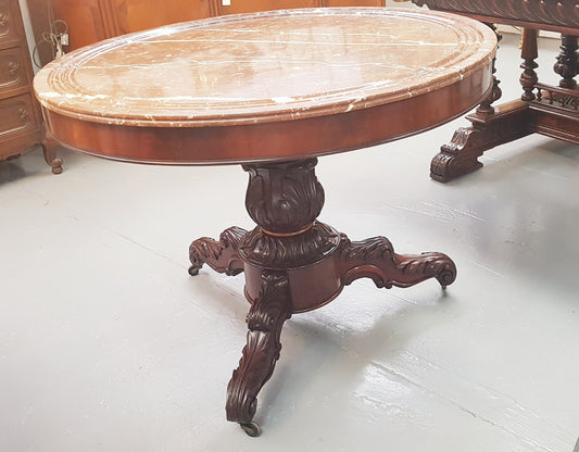A superb early 19th century French Louis Philippe mahogany centre table, with original round carved rough marble with reeded-edge and is in good original condition.