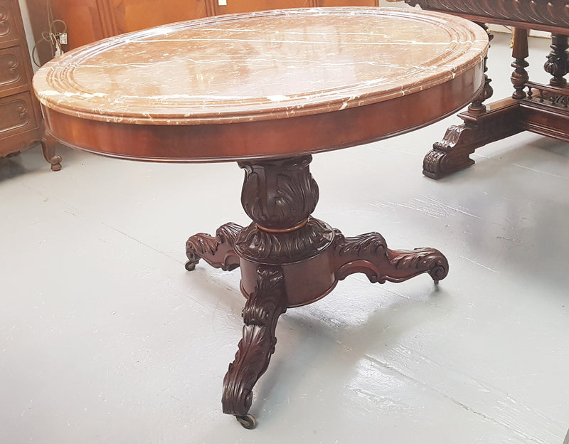 A superb early 19th century French Louis Philippe mahogany centre table, with original round carved rough marble with reeded-edge and is in good original condition.