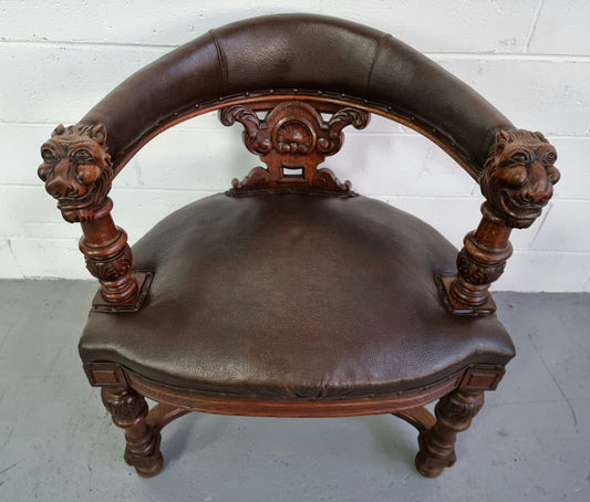 Henry 2nd style French Oak leather library chair with amazing detailed carvings. It is very comfortable to sit in and the leather is in good original condition.