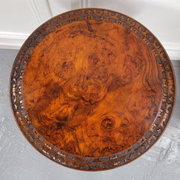 Rare early Victorian Irish Burr Walnut wine table. It has a beautiful carvings and a stunning burr walnut top, on a barley twist column and three shaped legs. It has been sourced locally and is in good original detailed condition. We also have a second table being sold separately which when together make a matched pair.