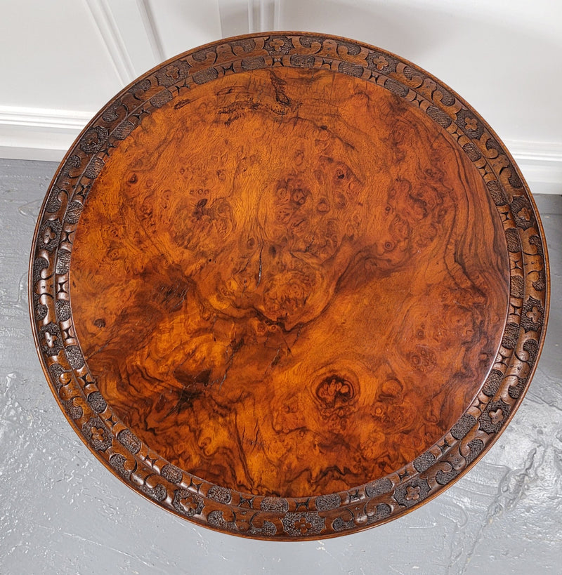 Rare early Victorian Irish Burr Walnut wine table. It has a beautiful carvings and a stunning burr walnut top, on a barley twist column and three shaped legs. It has been sourced locally and is in good original detailed condition. We also have a second table being sold separately which when together make a matched pair.