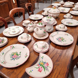 A pretty French table setting made in France called Luneville. It consists of plates, cups, saucers, tea pot, milk jug, sugar bowl, tureens and cake plates a total of 53 pieces. Please view photos as they help form part of the descriptions.