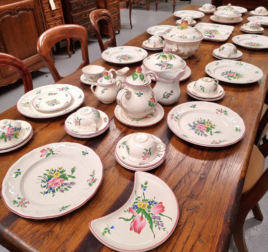 A pretty French table setting made in France called Luneville. It consists of plates, cups, saucers, tea pot, milk jug, sugar bowl, tureens and cake plates a total of 53 pieces. Please view photos as they help form part of the descriptions.