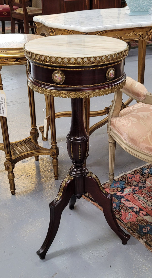 Elegant French louis XVI revival style round marble top side table with ceramic features and ormolu decoration. It is in good original detailed condition and has been sourced from France.