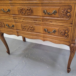 French Oak Louis 15th style nicely carved three drawer wooden top commode. It has been sourced from France and is in good original detailed condition.