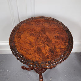 Rare early Victorian Irish Burr Walnut wine table. It has a beautiful carvings and a stunning burr walnut top, on a barley twist column and three shaped legs. It has been sourced locally and is in good original detailed condition. We also have a second table being sold separately which when together make a matched pair.