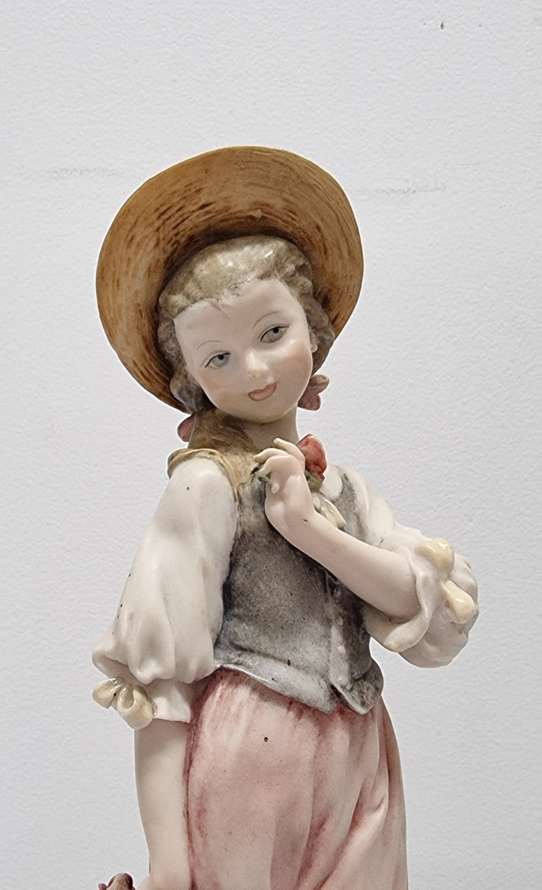 Lovely Italian figurine of girl carrying basket with flowers, figurine is on a wooden base. It is signed Giuseppe Armani and 1982 FLORENCE. In good original condition.  Please view photos as they form part of the description.