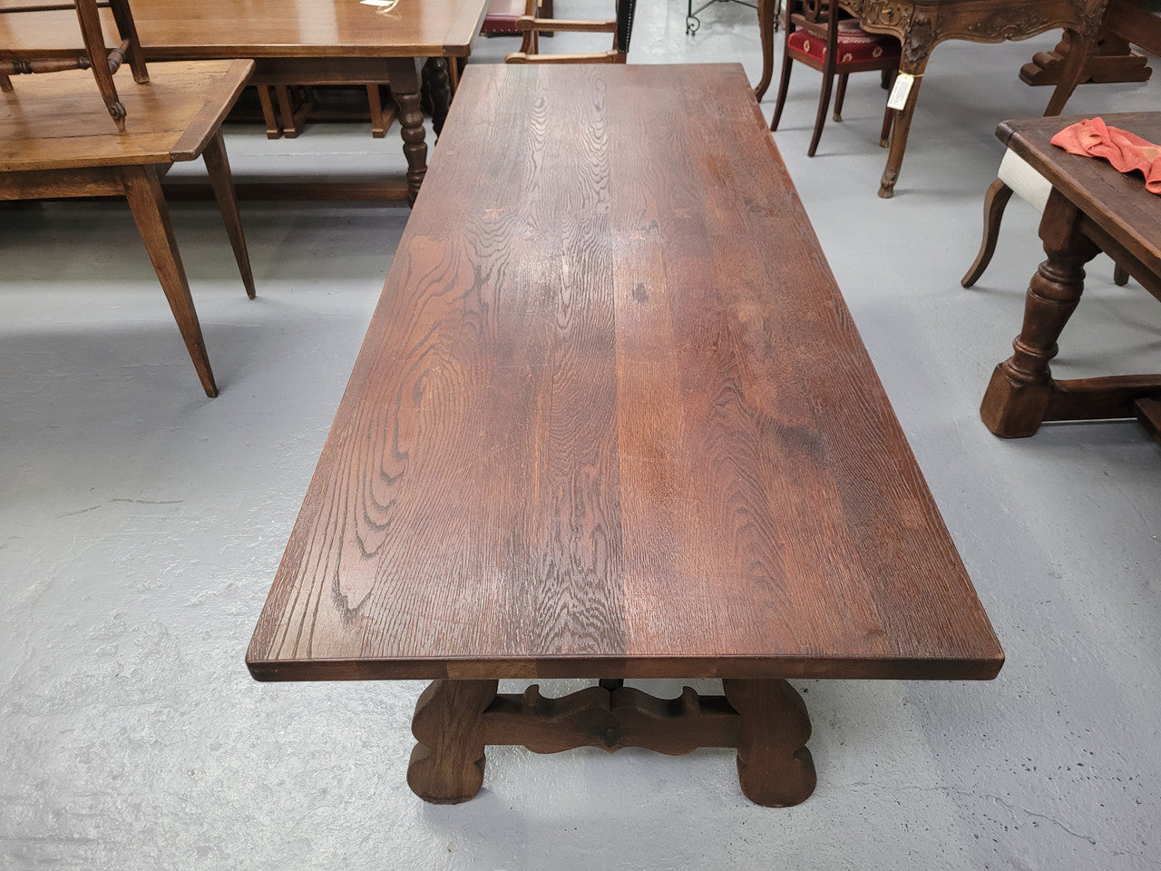 Spanish style French Oak farmhouse table with ironwork underneath. It is in good original detailed condition and has been sourced from France.
