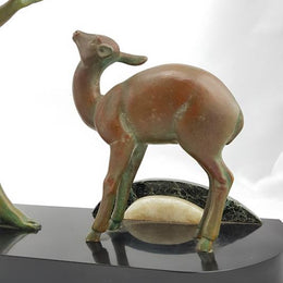 Absolutely gorgeous French cold painted metal Art Deco Statue of a lady and two deers on a marble base. Signed piece and in good original condition.