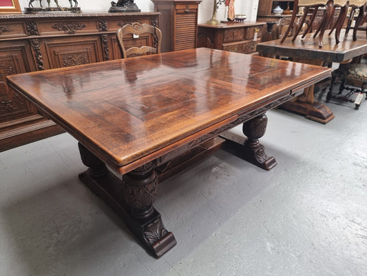 Renaissance style Oak extension table with parquetry top and twin pedestal base. The table extends by pulling out an extension leaf either side making it 287 cm long. Sourced from France and in good original detailed condition.