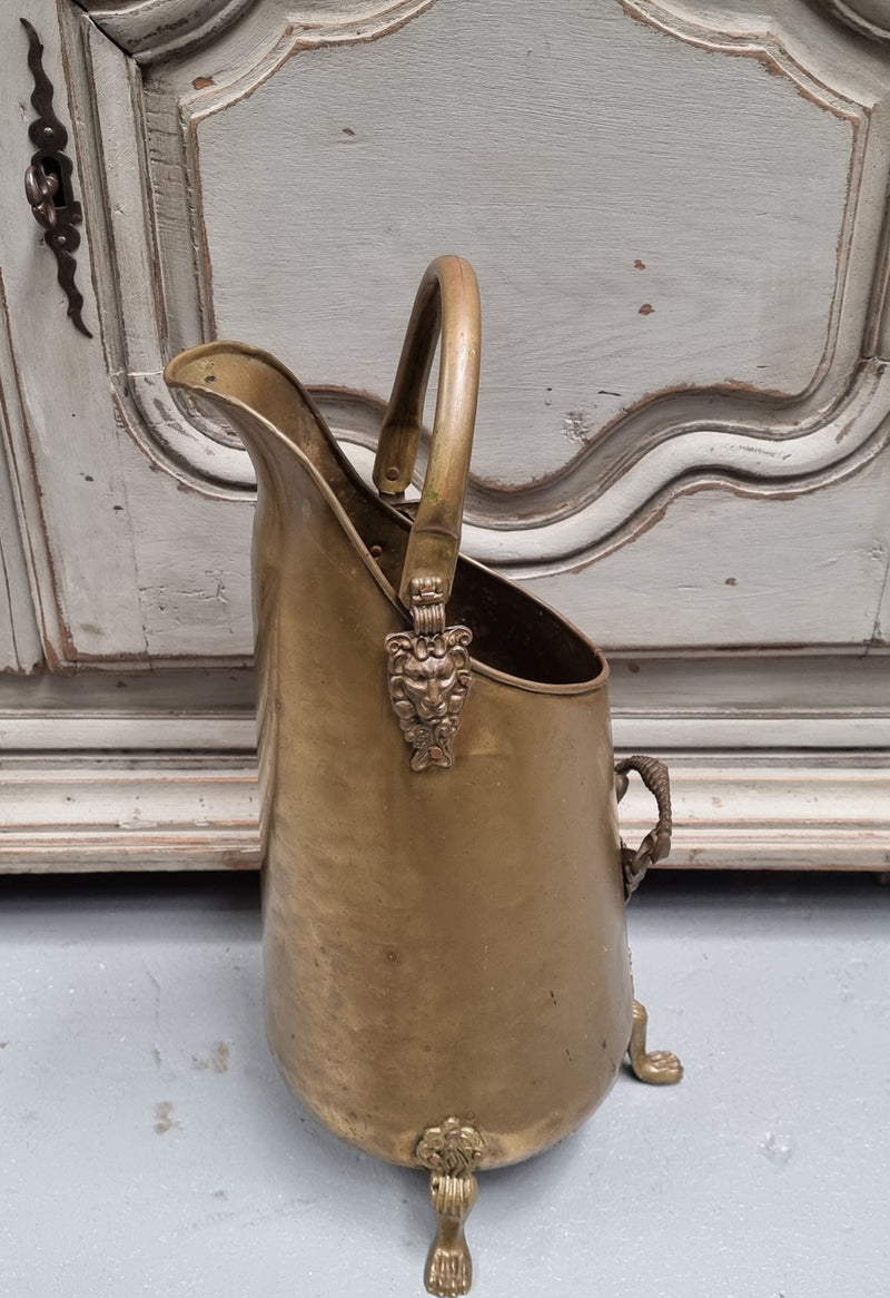 French brass coal bucket with Lion heads. In good original condition.