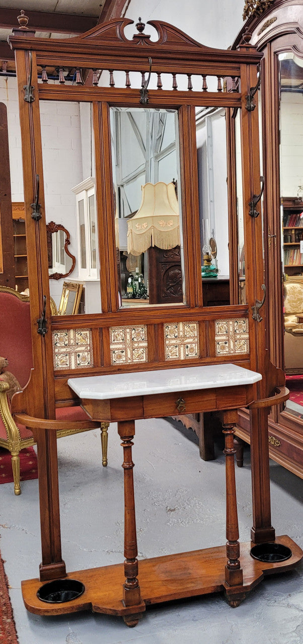 Late Victorian Arts and Crafts style marble top hall stand. Features three attractive tiles, original hooks and single drawer. In good original condition.
