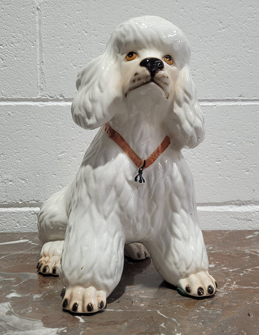 Vintage Italian ceramic Poodle figurine. It is beautifully detailed and in good original condition with no chips or cracks does have crazing to glaze.