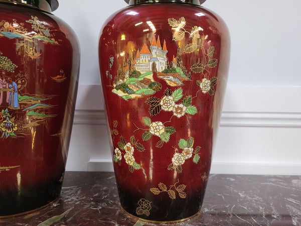 Matched pair of very large Crown Devon hand painted Ruby lustre vases with Lids. They are in good original condition with no chips or cracks.