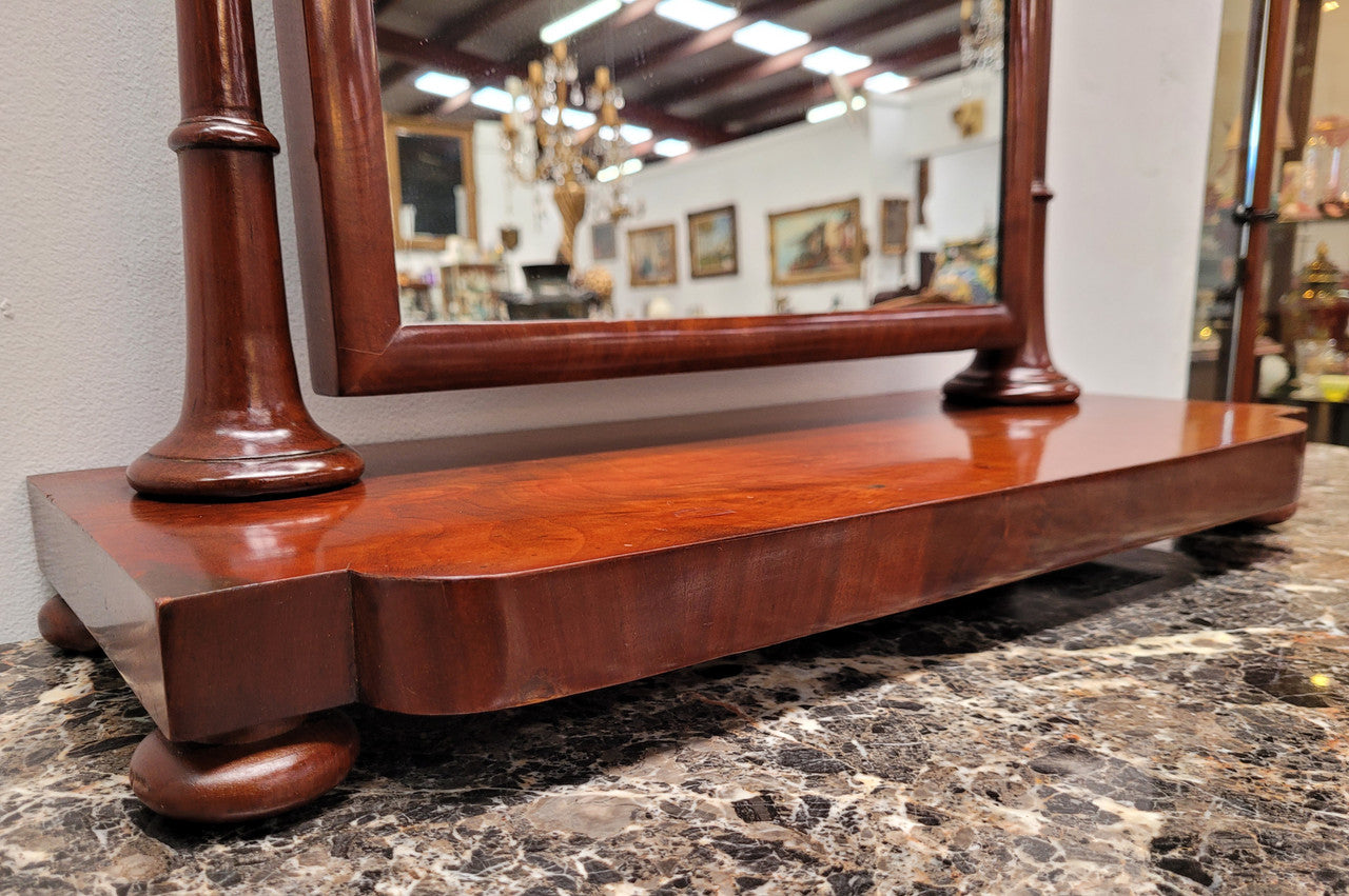 Antique Mahogany dressing table mirror. The mirror is still in good condition and tilts back and forward. It is in overall good original condition. Please view photos as they help form part of the description.