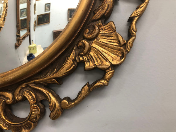 French gilt wood round convex mirror. In good original condition.