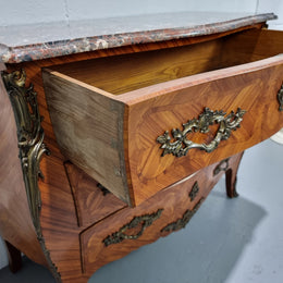 Attractive French marble top Louis XV style three drawer commode with decorative ormolu mounts. In good original detailed condition.
