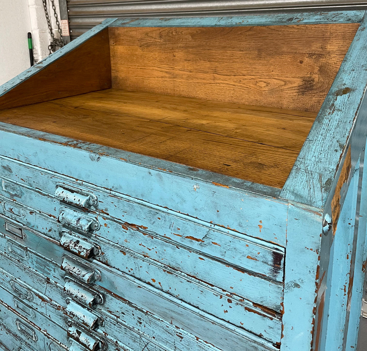Fabulous set of vintage painted blue printers drawers that have adjustable separators which can be taken out for large papers. The drawers are various sizes and there is a section on top for working on or for storing brushes or tall items . These would be perfect for artists or jewellery pieces or even architects. Such a beautiful piece of industrial furniture.