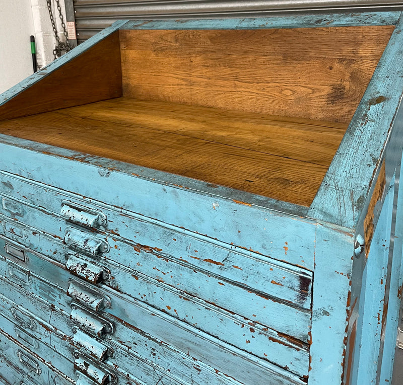 Fabulous set of vintage painted blue printers drawers that have adjustable separators which can be taken out for large papers. The drawers are various sizes and there is a section on top for working on or for storing brushes or tall items . These would be perfect for artists or jewellery pieces or even architects. Such a beautiful piece of industrial furniture.