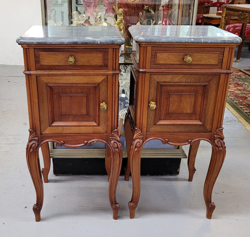 Pair of Walnut Louis XV style grey marble top bedside cabinets. Single drawer, one cupboard and lovely French cabriole legs. They have been sourced from France and are in good original condition.