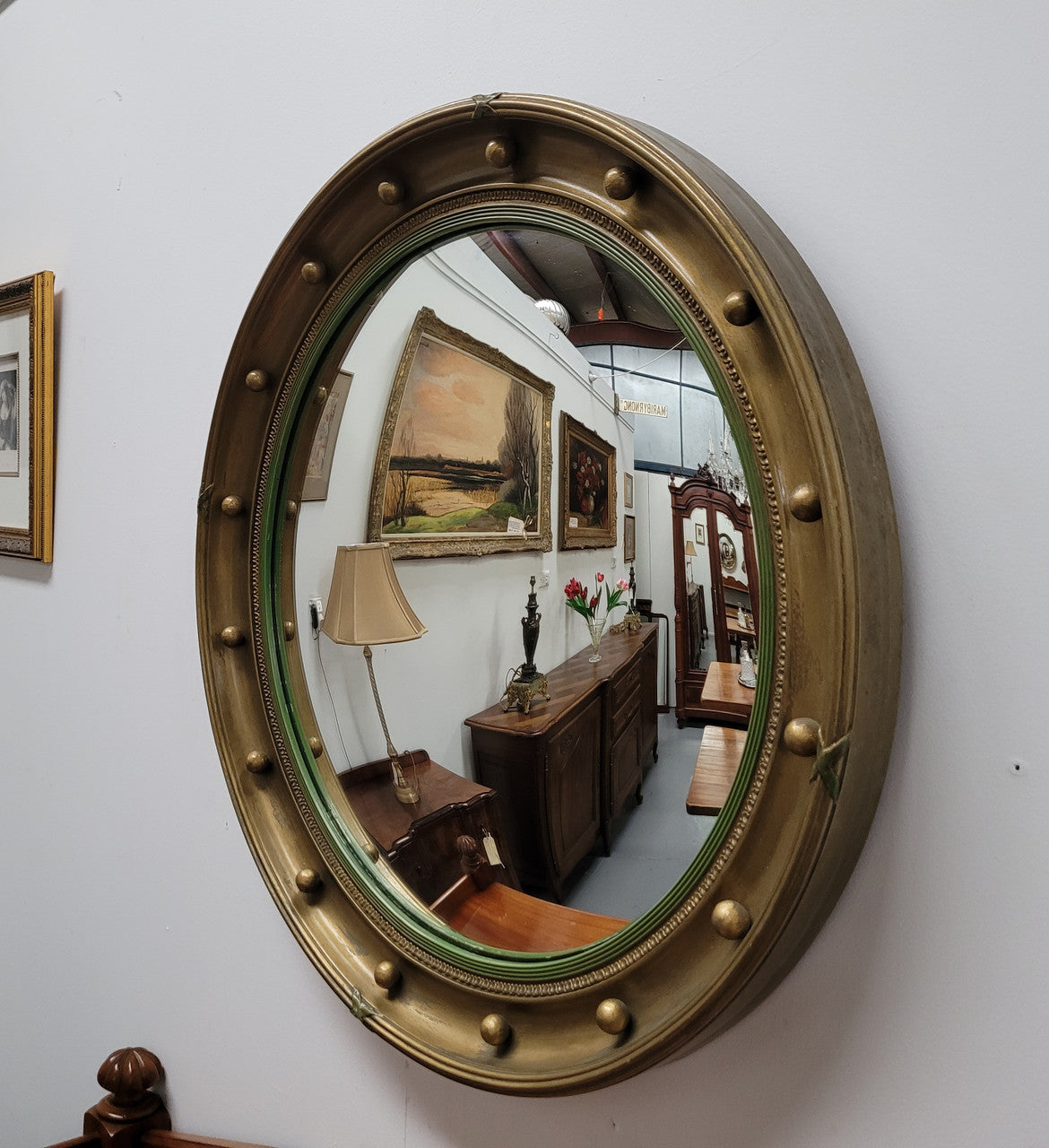 Large round French gilt framed convex mirror. It is a hard to find size with a total diameter of 67 cm. It has been sourced from France and is in good original condition.