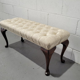 Vintage neutral upholstered buttoned stool. Fabric is in good used condition, please view photo's has they help form the description. The stool its self is in good condition.