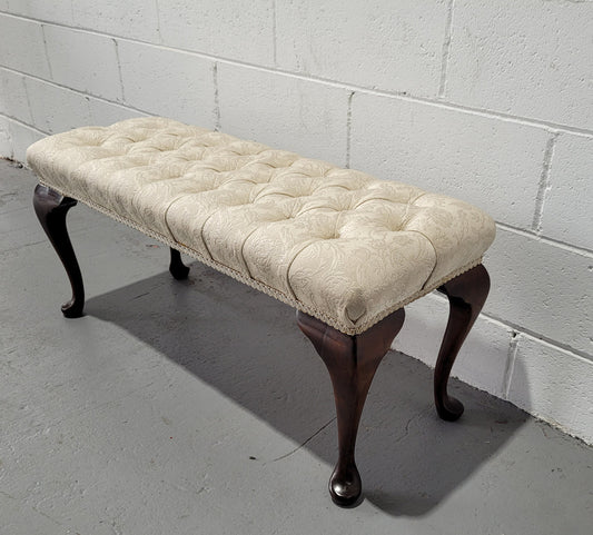 Vintage neutral upholstered buttoned stool. Fabric is in good used condition, please view photo's has they help form the description. The stool its self is in good condition.