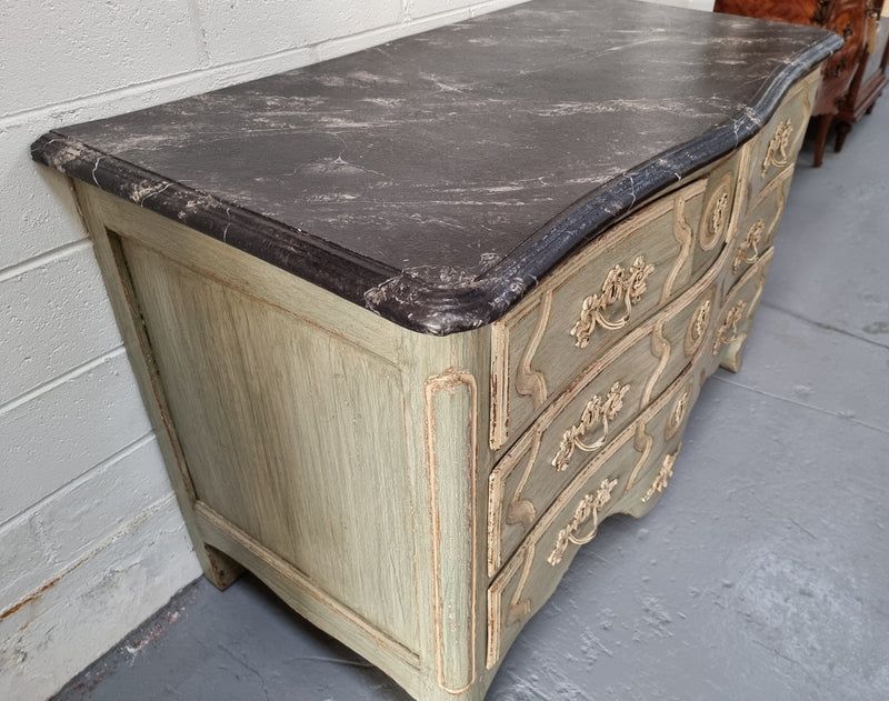 Early 19th Century Louis XIV style faux marble top and painted base commode. It is of large proportions and has four drawers. In good original detailed condition.