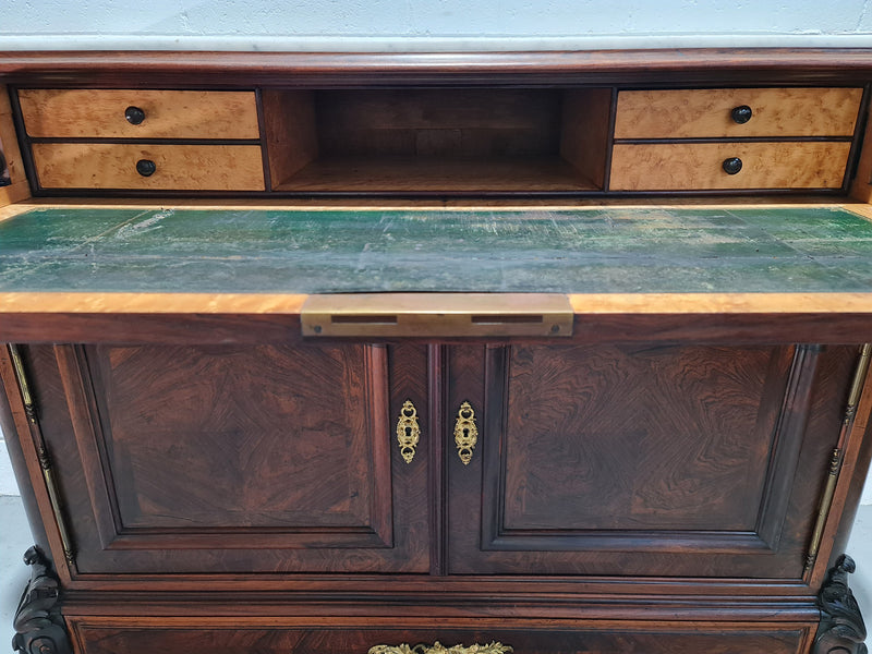 Stunning Rosewood Marble Topped Secretaire with two cupboards. Cupboards open to three fitted drawers and an additional secret drawer beneath the cupboard. All sitting on lovely carved legs and decorated with ormolu mounts. Circa: 1860. In good original detailed condition.