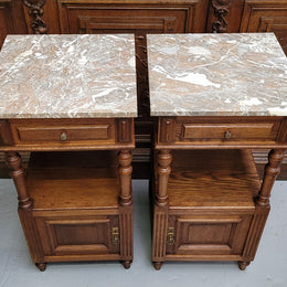 Pair of French Antique Oak marble top bedsides Henry II style. They have a drawer, cupboard and an open shelf for all your storage needs. They have been sourced from France and are in good original detailed condition.