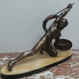 An Art Deco large signed bronze statue, on a marble base showing strength by renowned artist Salvatore Megani. The statue is in good original condition.