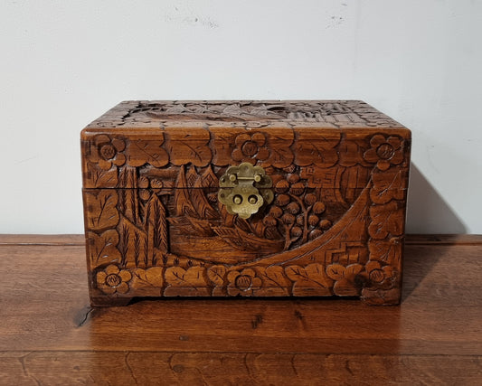 Small Chinese carved camphor wood jewellery box. It is in original condition.