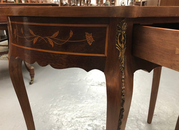 Stunning small inlaid French Walnut Louis XV style hall table with ormolu mounts and beautiful details. It has been sourced from France and is in good orignal detailed condition.