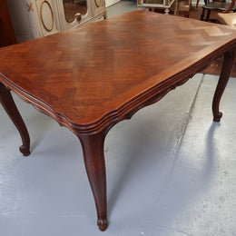 Beautiful French Oak Louis XV style parquetry top extension table. When fully extended the tables length is 239 cm. It is in good original detailed condition.