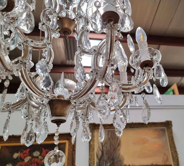 Sourced From France an attractive eight arm French crystal chandelier. It has been fully rewired to Australian standards and is in good original working condition.