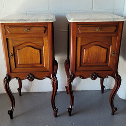 Pair of Louis XV style Walnut bedside cabinets marble top. Circa 1900 and in good original detailed condition.