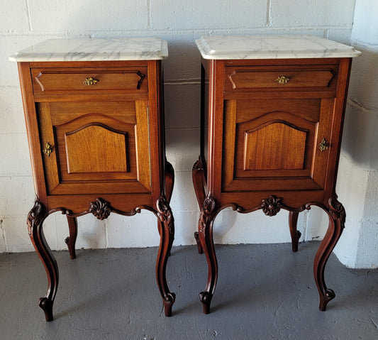 Pair of Louis XV style Walnut bedside cabinets marble top. Circa 1900 and in good original detailed condition.