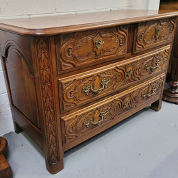 French Cherrywood Louis XIV style wooden topped chest of four drawers. It has been sourced from France and is in good original detailed condition.
