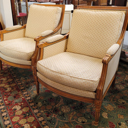 Pair of Louis XVI style 19th Century walnut upholstered Bergère chairs with loose cushions. They have been sourced from France and is in good original detailed condition. The fabric is in good original used condition, please view photos as they help form part of the description.