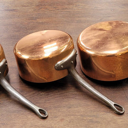 Set of five copper sauce pans with foundry stamp. They have been sourced from France and are in good original detailed condition.