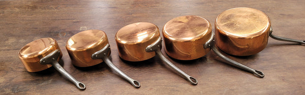 Set of five copper sauce pans with foundry stamp. They have been sourced from France and are in good original detailed condition.