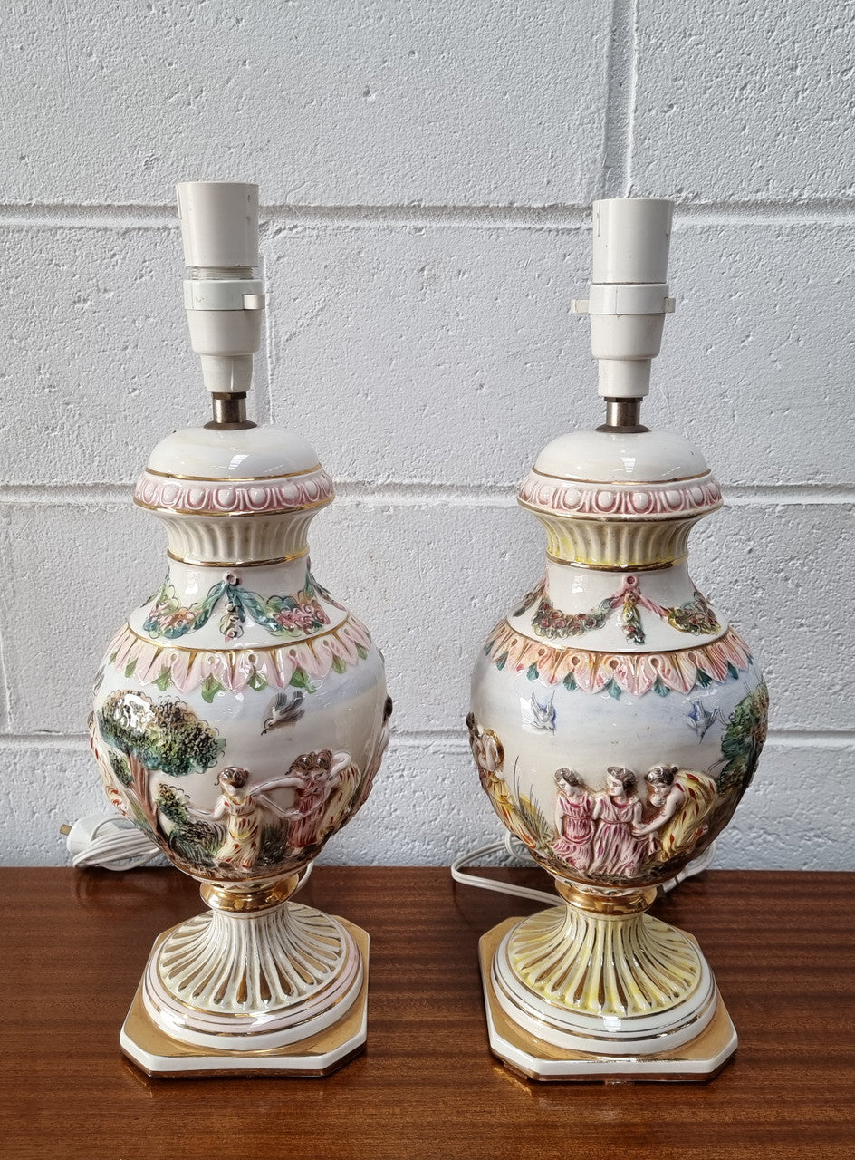 Pair of hand painted capodimonte vintage table lamps. In good original detailed working condition.