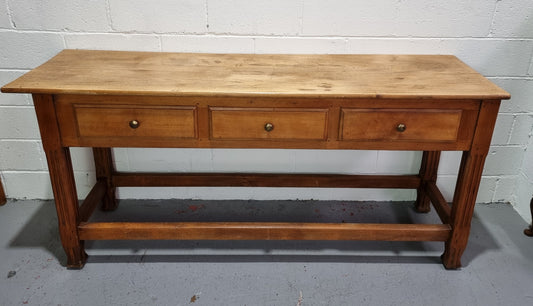 Late 19th Century Cherrywood console table with three drawers. In good used, detailed rustic condition.